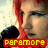 A pixelated image shows a person with light skin and dark hair, wearing a black jacket over a red shirt, with the word 'PARAMORE' in yellow block letters on a red banner at the bottom.