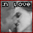 Black-and-white pixelated image of a person with a red and black border, displaying ':in LOVE' text at the top.