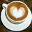 A four- shows a coffee cup with heart latte art, pink sleep mask on white surface, hands holding paper with text, and two people kissing