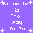 Purple background with white pixelated text reading "Brunette is The Way To Go" repeated twice, surrounded by white plus signs.