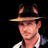 Static pixelated image of a person wearing a fedora hat and light-colored shirt against black background.