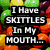 Pixelated text overlays on a rainbow-colored background with Skittles candies visible in the upper left.
