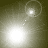 Four- showing a bright light source moving across dark background with dotted trail and circular halo effect