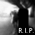 Black-and-white pixelated image showing a dark silhouette of a figure with outstretched arms against a gradient background, with 'R.I.P.' text at the bottom.