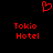 Red pixelated heart symbol above two identical red text blocks reading Tokio Hotel on black background.