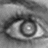 A grayscale pixelated image of a stylized eye with concentric circular patterns and a bright central highlight.