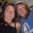 Two people pose closely together in a pixelated image with text reading 'e And Kore' on the right side.