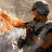 Animated contact sheet showing three sequential frames of a soldier in silver armor with helmet, holding a weapon and emitting orange flame effects against rocky background.