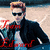 Pixelated static image of a person with light brown hair wearing dark sunglasses, a black jacket over a white shirt, and red accents on the jacket, standing against a blurred background.
