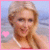 A 50x50 pixel animated contact sheet showing two frames of a woman with blonde hair in a red bikini top against a beach background, with a pink border and heart symbol changing from solid to outline.
