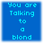 Blue square with cyan pixelated text reading 'You are Talking to a blond' in four arranged in a