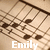 Pixelated image with brown and beige tones showing abstract shapes resembling a chair or furniture, overlaid with white text reading "Emily" at the bottom.