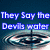 Four- of water ripples with blue text reading "They Say the Devils water It ain't so sweet, but you can dip your feet In for just a little while" on dark blue background
