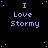 identical pixelated text elements on a black background with scattered blue dots, each reading "I Love Stormy" in light purple