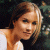Pixelated image of a person with light brown hair wearing white and black clothing, next to green text reading Original Icons .com on dark background.
