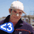 Two static images of a person in a white cap and dark jacket with a blue '<3' symbol, and a red background with white text.