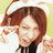 A pixelated image of a person with brown hair wearing white bunny ears, set against a pink background with text reading "i shall attack you" and "with guns and banjos xDDD".