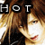 A pixelated image of a person with brown hair and red lips, featuring the text 'HOT' in white letters on black squares at top left.