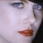 A 4-frame contact sheet of a woman's face with red lipstick, showing subtle eye and mouth movements across frames.