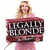 A woman in a pink dress holds a sign reading LEGALLY BLONDE, with a group of women in pink dresses below her and a blue background with two people above.