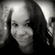 Black-and-white pixelated image of a person with long dark hair, light skin tone, and visible facial features including eyes, nose, mouth, and chin.