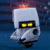 Pixelated icon of a white robot head with glowing yellow eyes and a red light on top, set against a dark blue background.