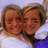 Two pixelated faces in close proximity, one wearing a white shirt and the other a dark top with blue fabric visible.