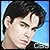 Two side-by-side pixelated portraits of a young man and woman with distinct backgrounds, one blue and one light gray.