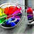 A glass of rainbow-colored liquid with a red straw, two hands forming a heart shape holding a glowing yellow-orange object, and a beach scene with a heart drawn in the sand.
