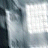 A pixelated image shows a figure in light clothing against a dark background with two bright rectangular areas, one of which contains the word 'INSANE' at bottom right.