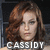 Pixelated portrait of a person with brown curly hair and light skin, featuring the text "CASSIDY" in white block letters at the bottom.
