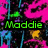 Pixelated static icon with bright pink background, green text reading 'Maddie', and scattered blue, yellow, and purple pixel clusters.