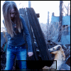 A woman with long brown hair in a blue top and jeans stands beside a dog in a wooden fence setting, with text overlays changing across frames.
