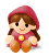 Pixelated character with brown braided hair, red hooded outfit, and yellow circular chest emblem sitting against gray background.