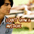 Pixelated image of a person in a white shirt and blue jeans holding a sign with 'NEXT STOP' text, standing in front of a blurred background.