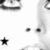 A static pixelated image shows partial views of a character's face with large eyes and a star symbol on a white background.