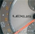 Pixelated static image with a central light gray area containing dark gray horizontal bars, surrounded by a mix of brown, white, and orange pixels on the left and right edges.