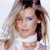 Pixelated close-up of a person with light brown hair, blue eyes, and a white top against a light background.