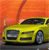 A yellow car with a dark roof and silver wheels is positioned on a gray surface against an orange gradient background.