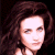 A pixelated image of a person with long brown hair against a dark background, next to green text reading 'Original Icons .com' on a solid green backdrop.