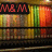 four showing a bookshelf with colorful spines, where the top-right displays green text reading "Mania" and the top-left has red text "M&M"