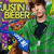 A pixelated image of a person in a green jacket holding a blue guitar, with 'JUSTIN BIEBER' text above, displayed in a