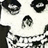 A pixelated black-and-white skull image with red and gray background sections containing text.