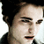 Pixelated close-up of a person's face with dark hair, light skin, and a neutral expression against a light background.