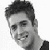 Static grayscale pixelated image of a person's head and shoulders in profile view with visible facial features, hair texture, and clothing details against a plain white background.