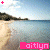 A beach scene with water, sand, and hills under a blue sky; pink text reading 'Kaitlyn' appears below the image.