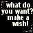 Black background with white pixelated text repeating 'what do you want? make a wish!' surrounded by pink and brown star-shaped dots.