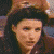 Four-frame contact sheet of a woman with dark hair wearing a brown hat and maroon top in various facial expressions across sampled frames.