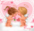 Pixelated cartoon of two winged figures kissing under a heart-shaped background with floating hearts and flowers.