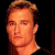 A pixelated contact sheet showing two frames of an animated buddy icon featuring a person's face on the left and green text reading "Original Icons .com" on the right against a dark background.